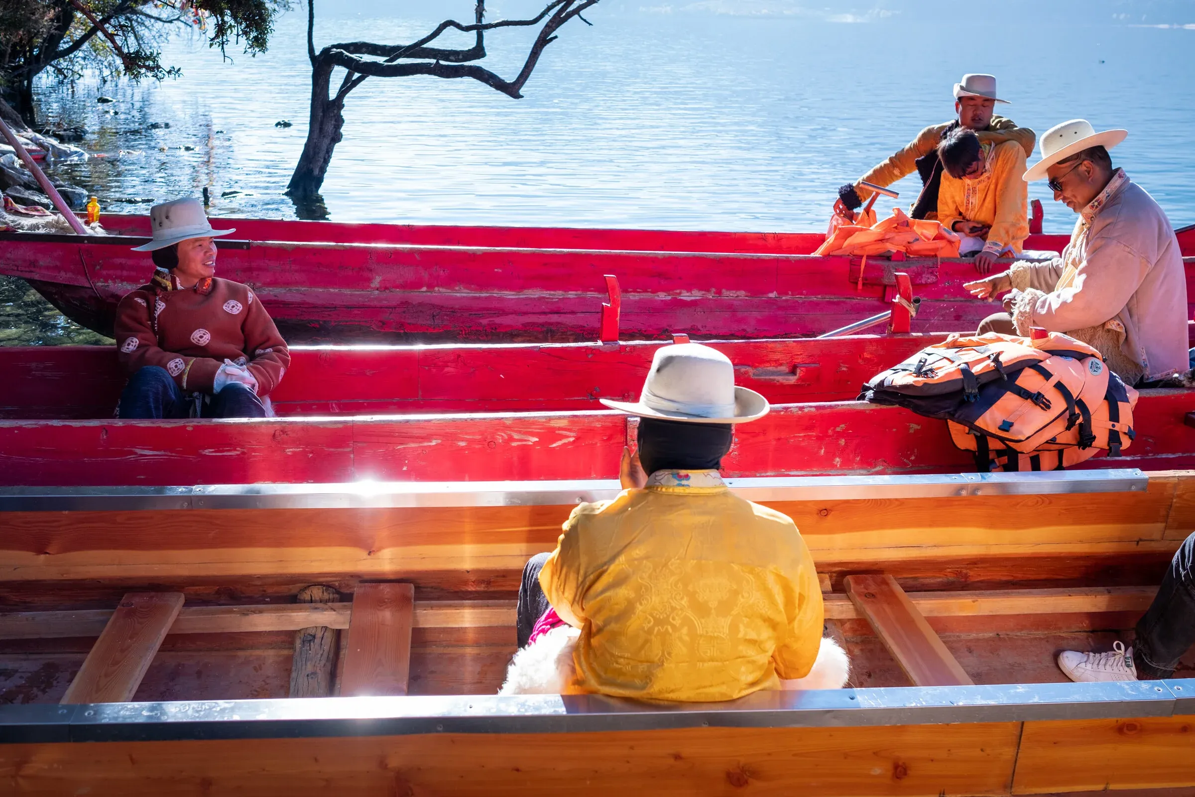 Mosuo men on donkeys carrying goods across the mountain