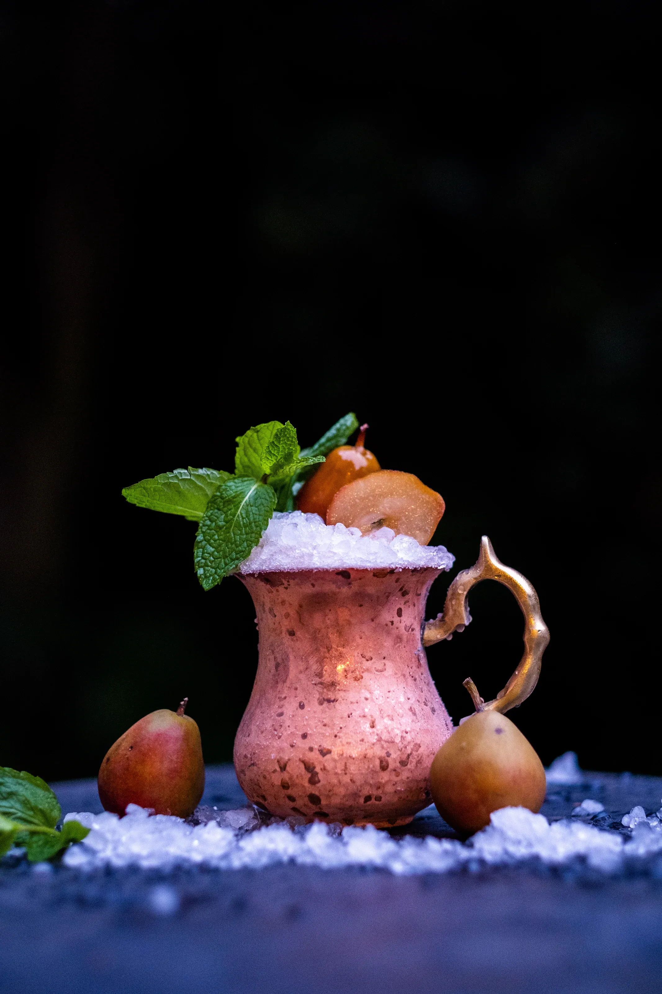 Croft-y Pear Julep cocktail with mint sprigs and poached baby pears