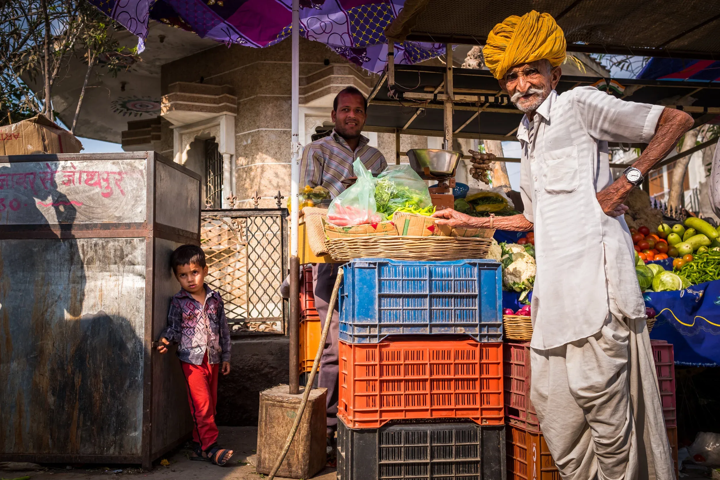 Street scene in Jojawar with locals and bulls