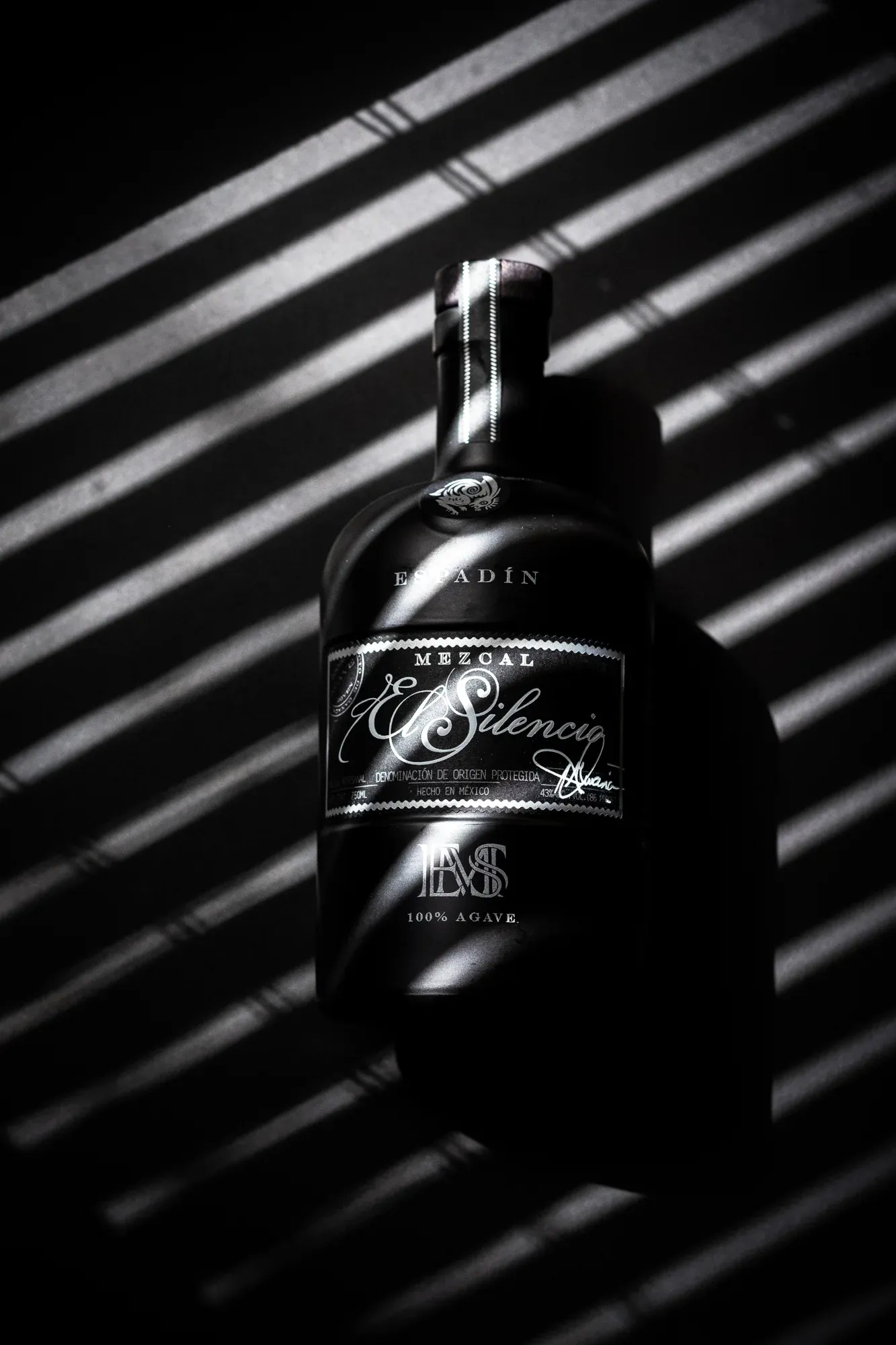 Mr. Berry Goes Black cocktail detail with bay leaf garnish