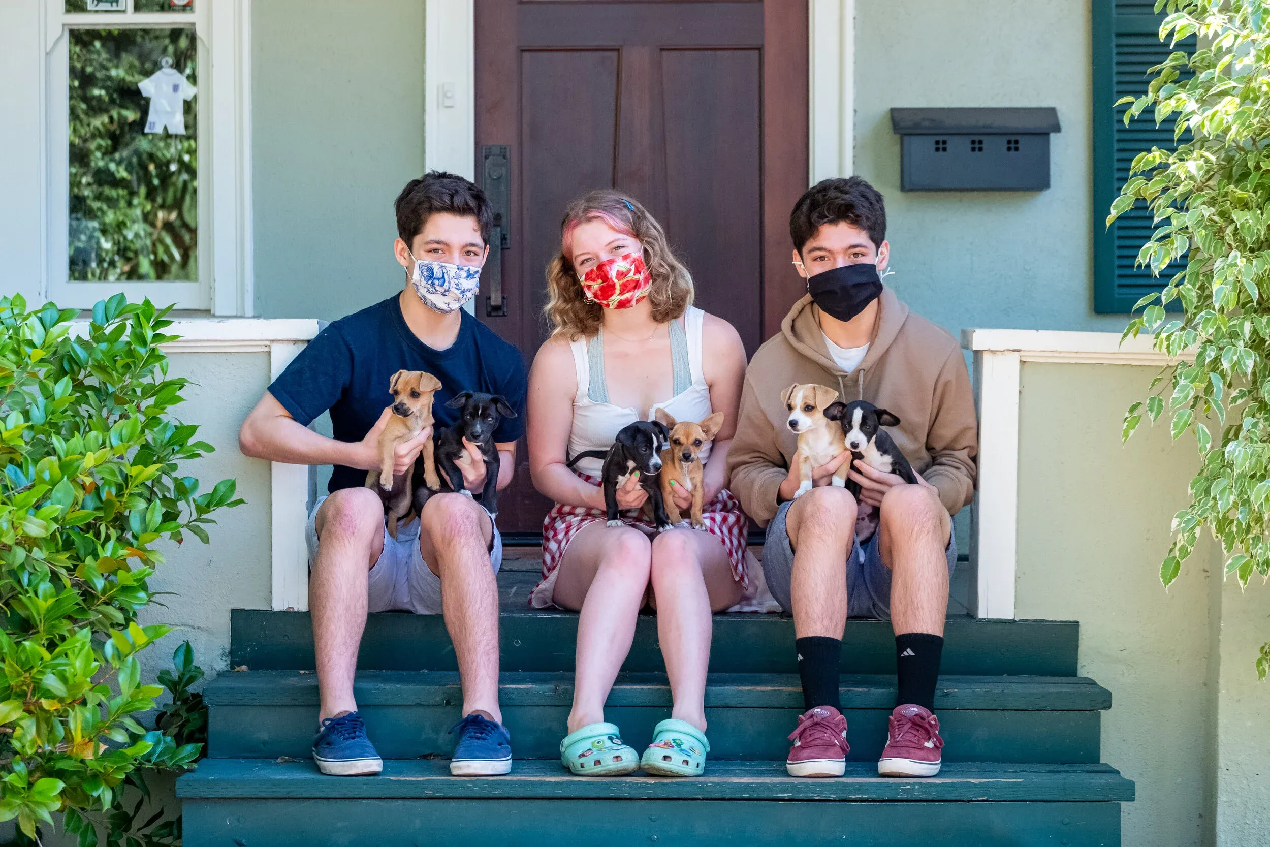 Family with their pet on front steps in Palo Alto