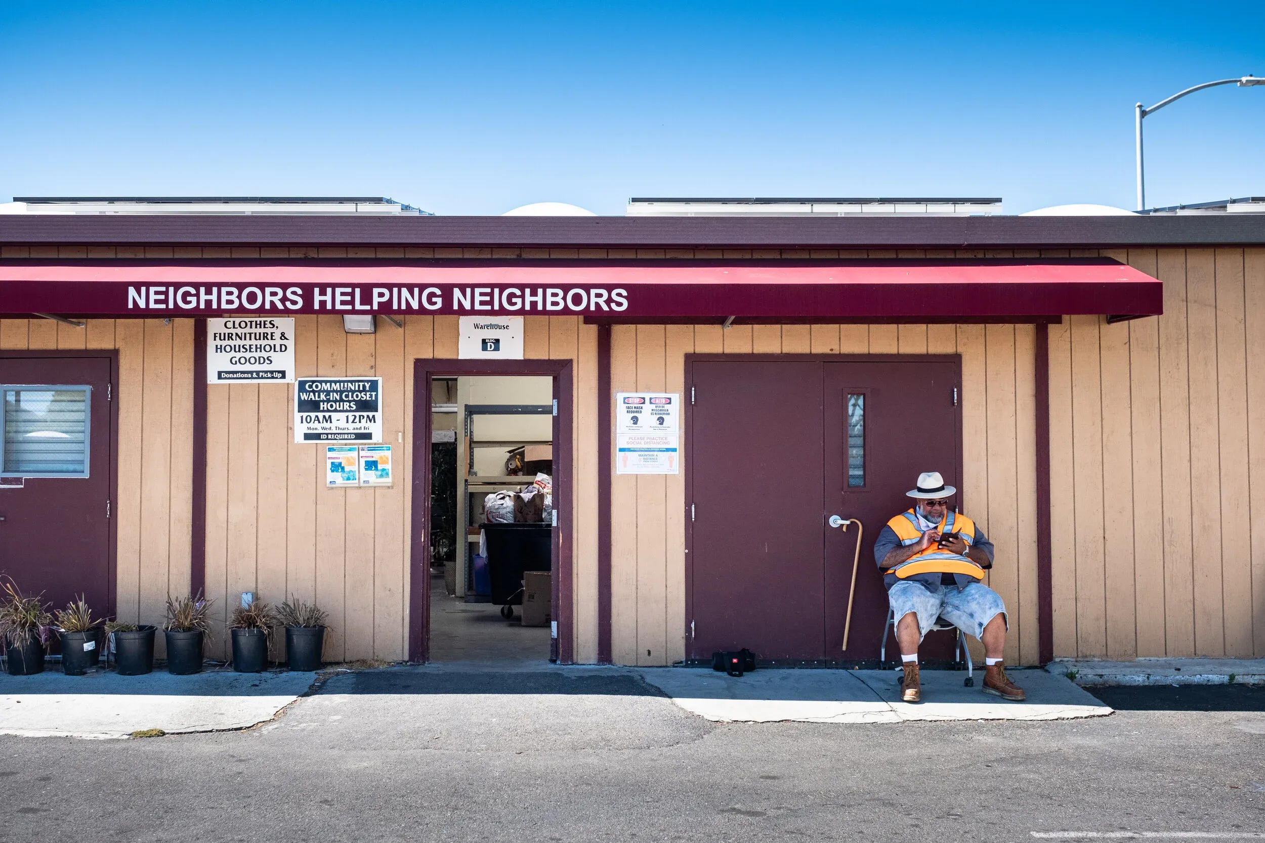 Ecumenical Hunger Program building with Neighbors Helping Neighbors sign