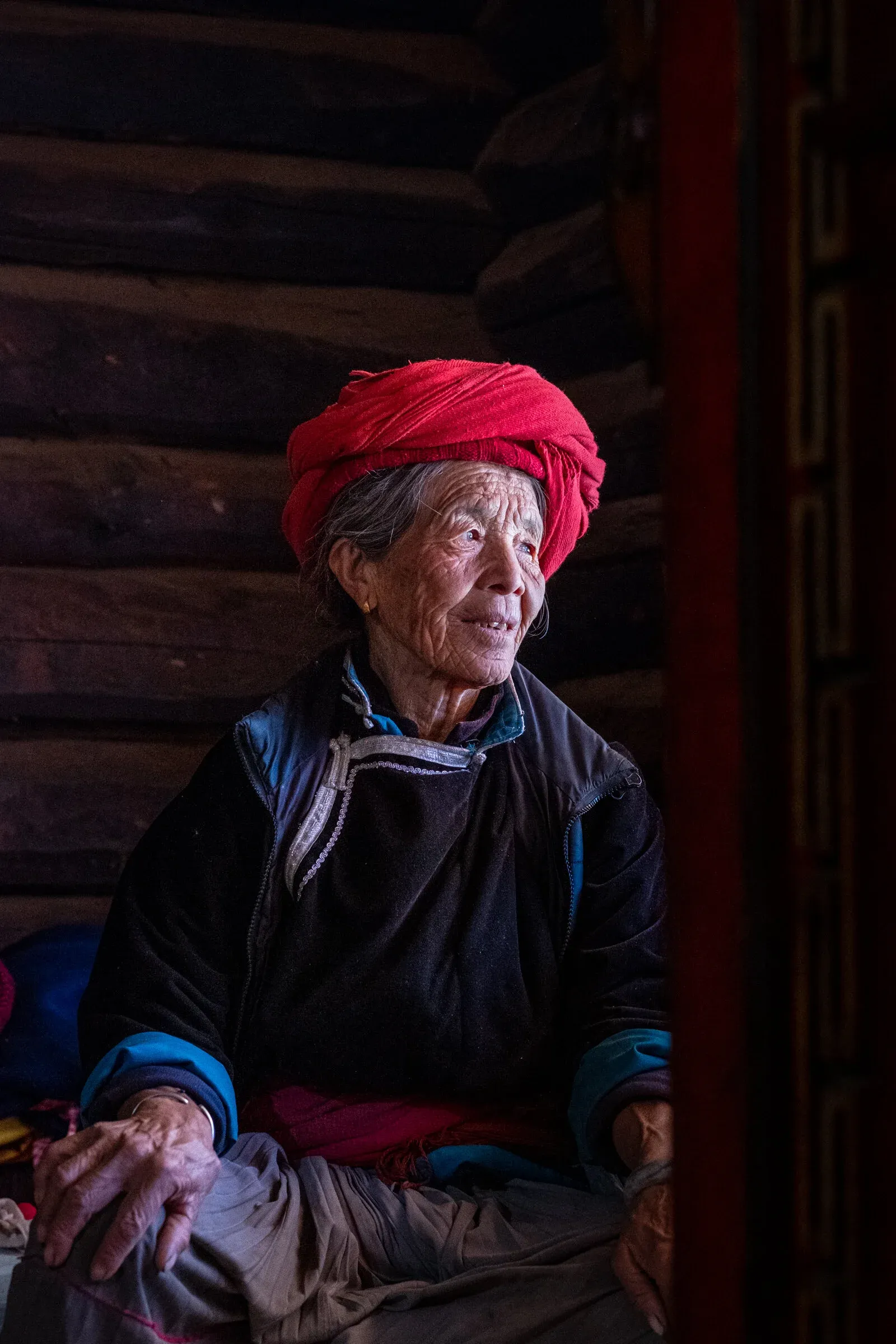 Mosuo woman with deep wrinkles from years of hard work