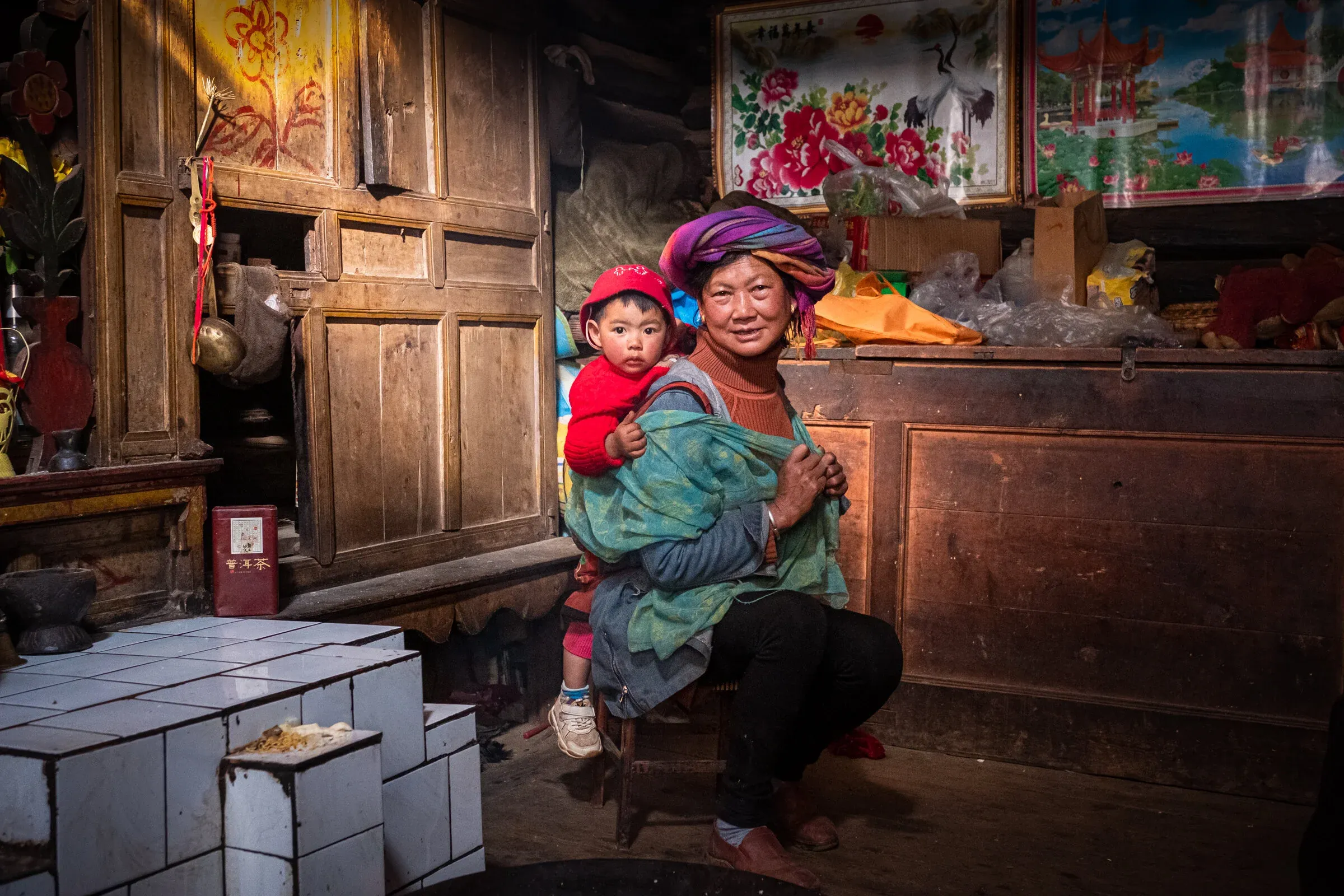 Mosuo grandmother taking care of grandchildren