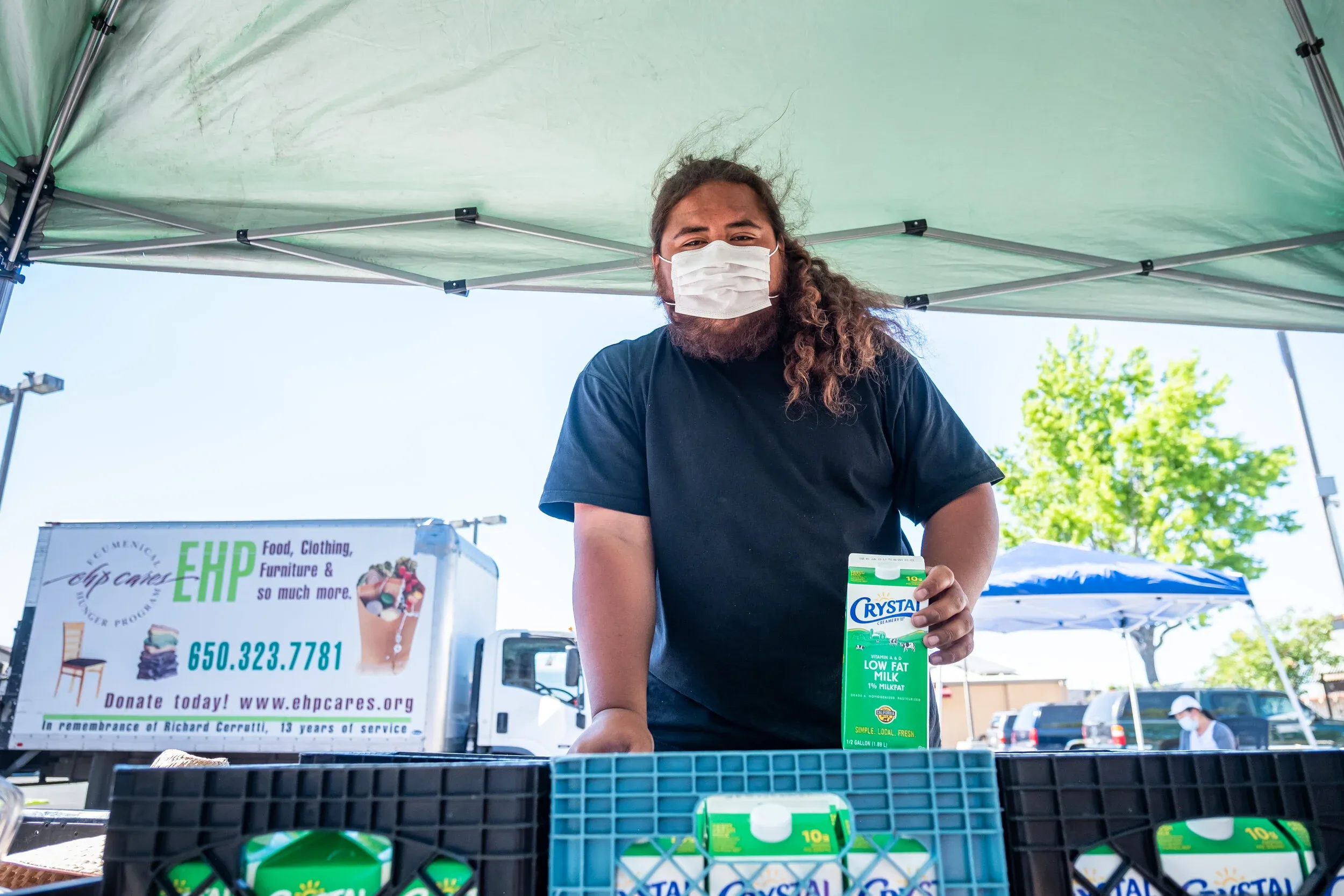 James giving out milk at the Ecumenical Hunger Program