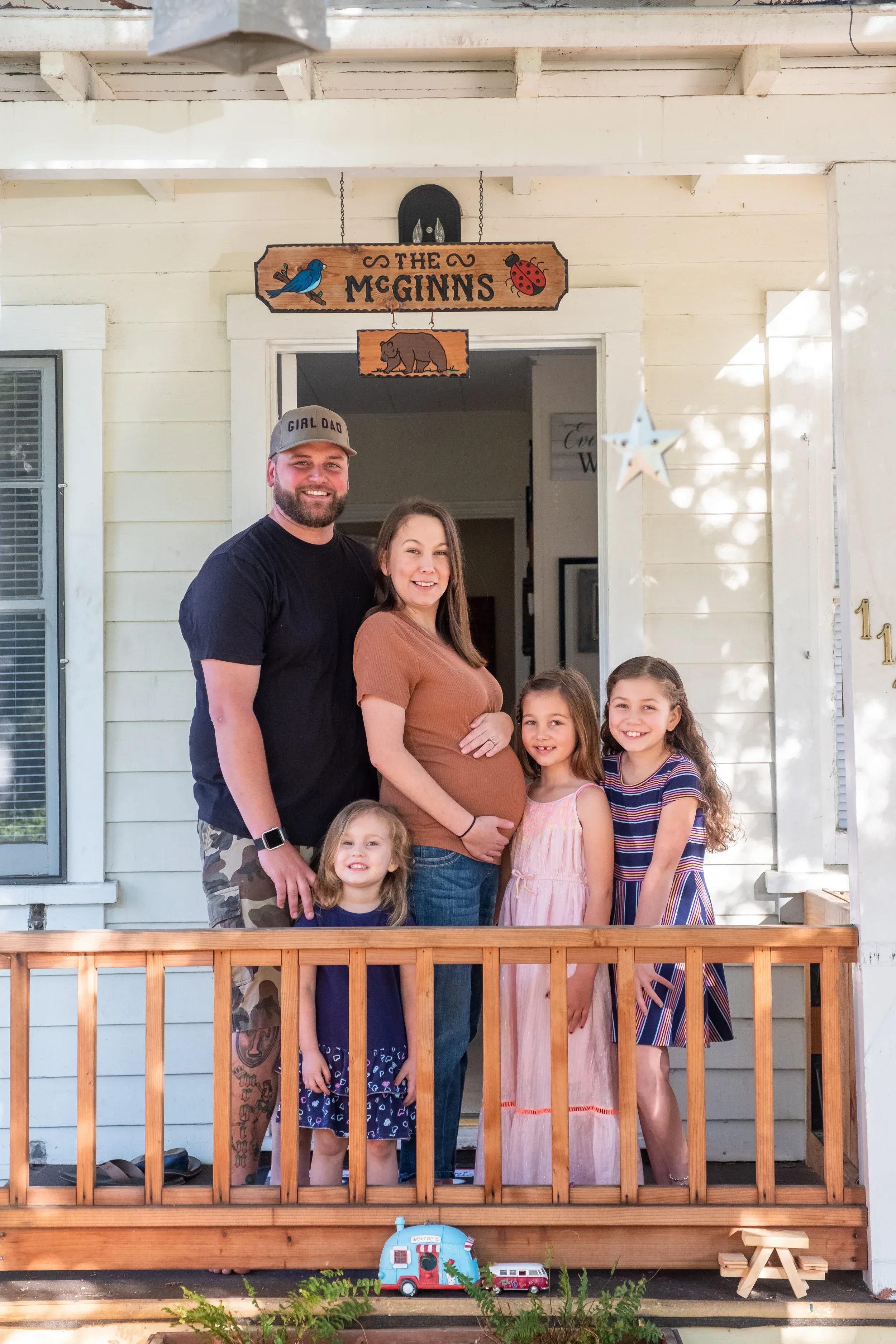 Expecting family portrait on front steps in Palo Alto