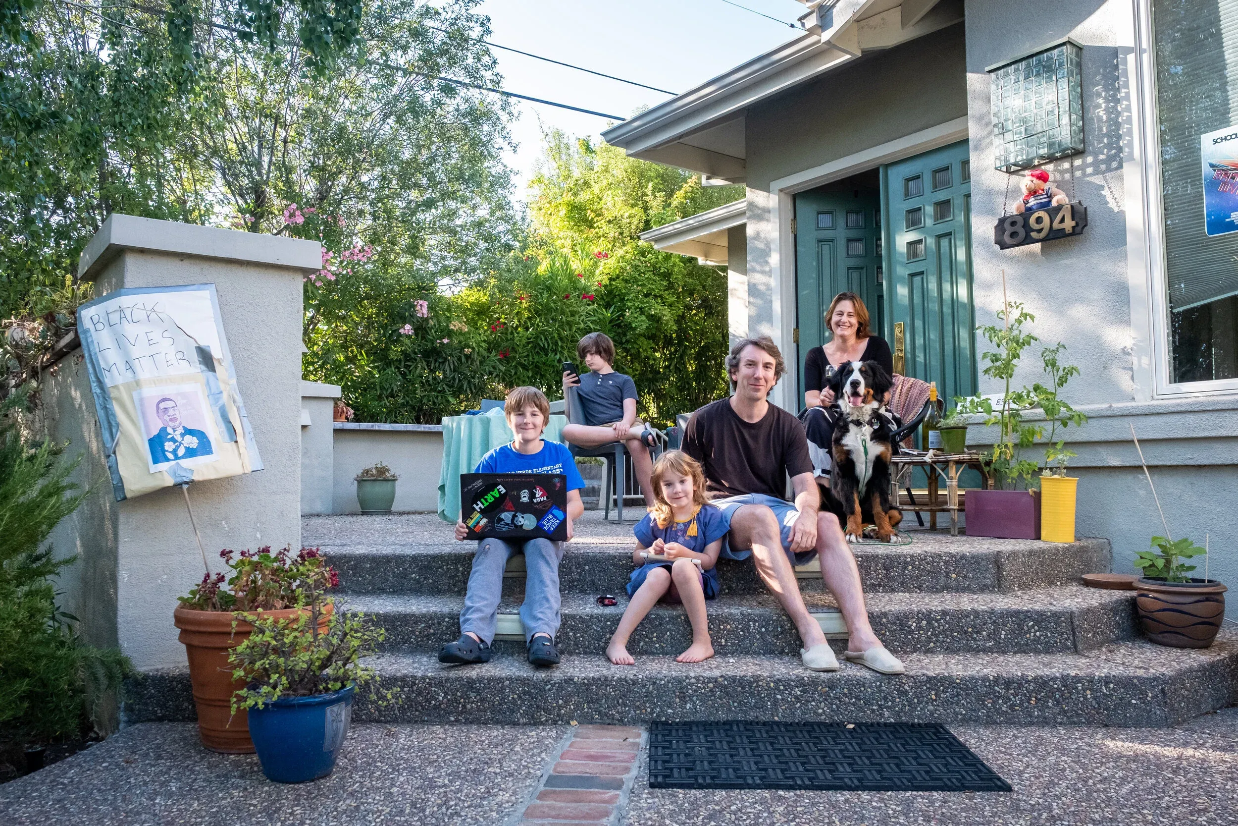 Creative family portrait setup on front steps