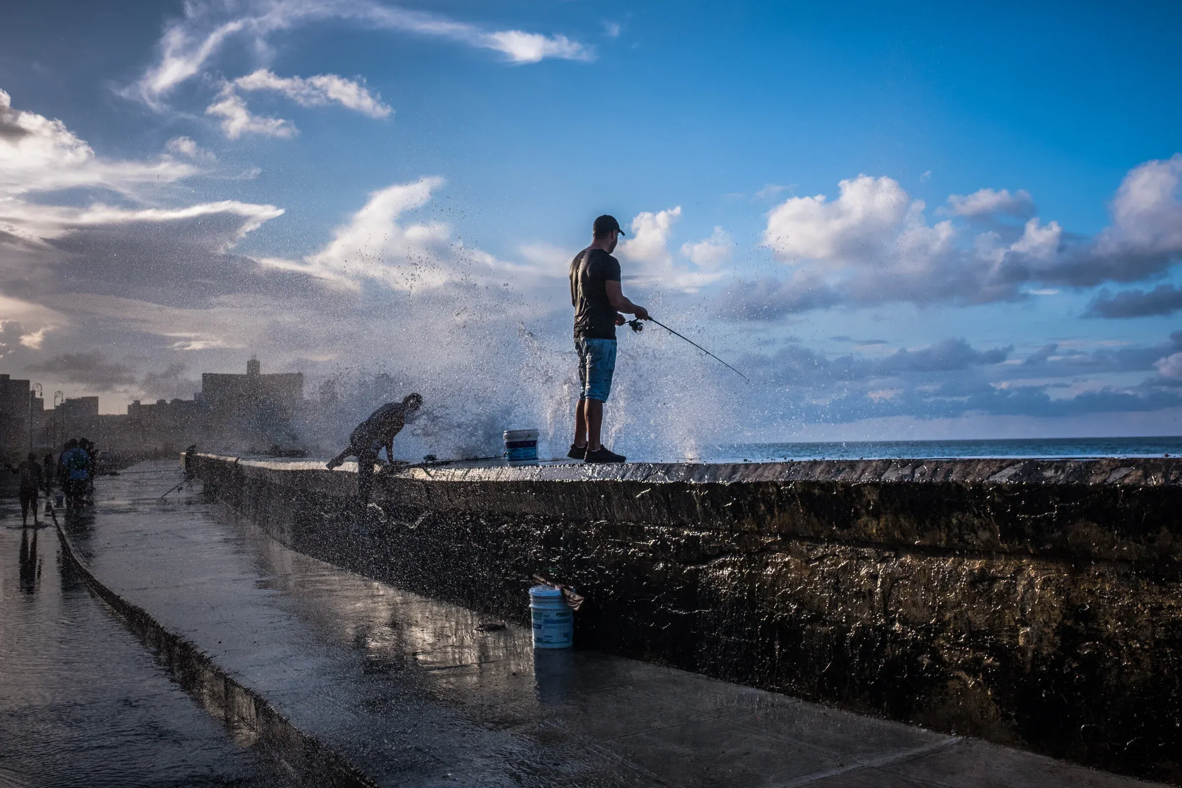 Elders along the Malecón seawall