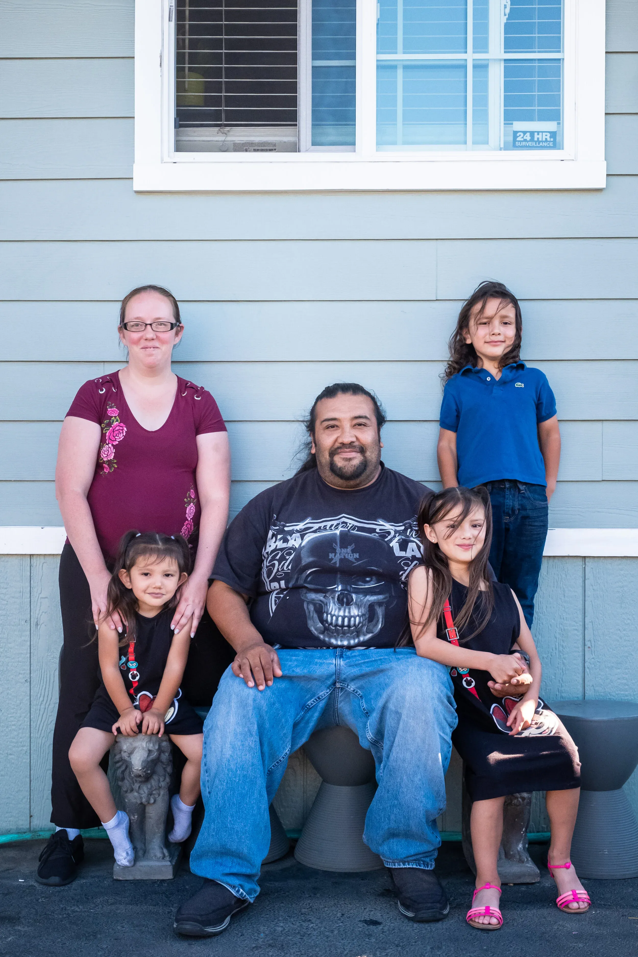 Shannon, Juan, and their three children at their mobile home in East Palo Alto