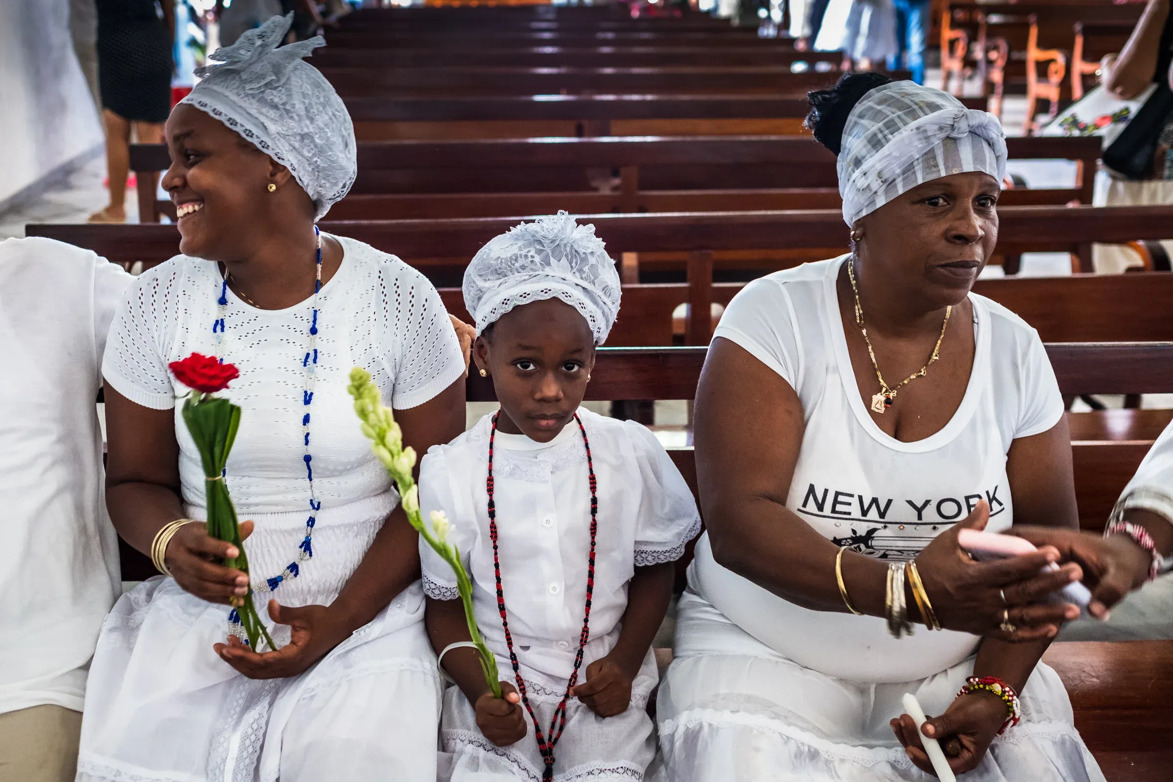 Family in white going through Santeria initiation