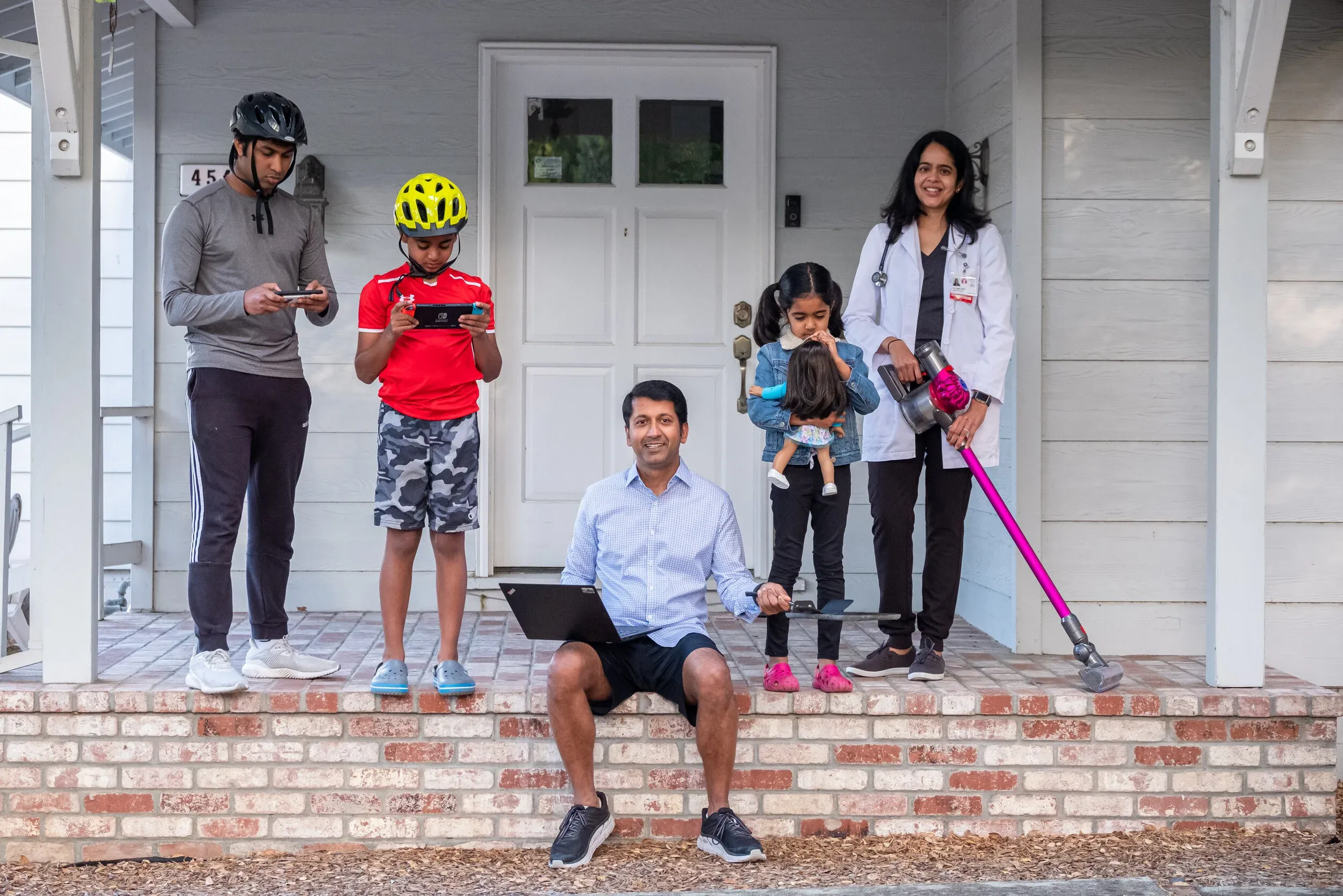 Creative family portrait setup on front steps