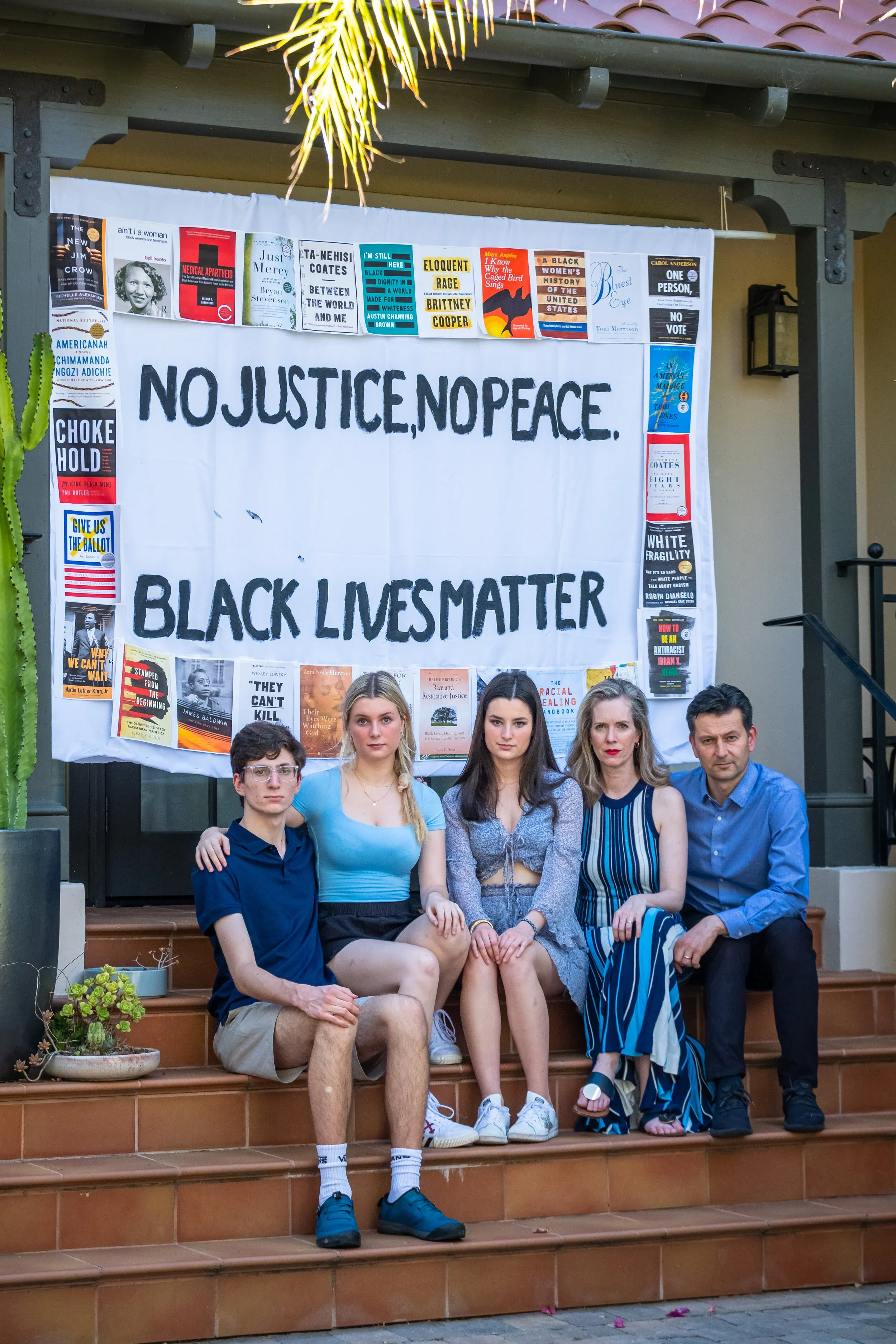 Family supporting Black Lives Matter on front steps